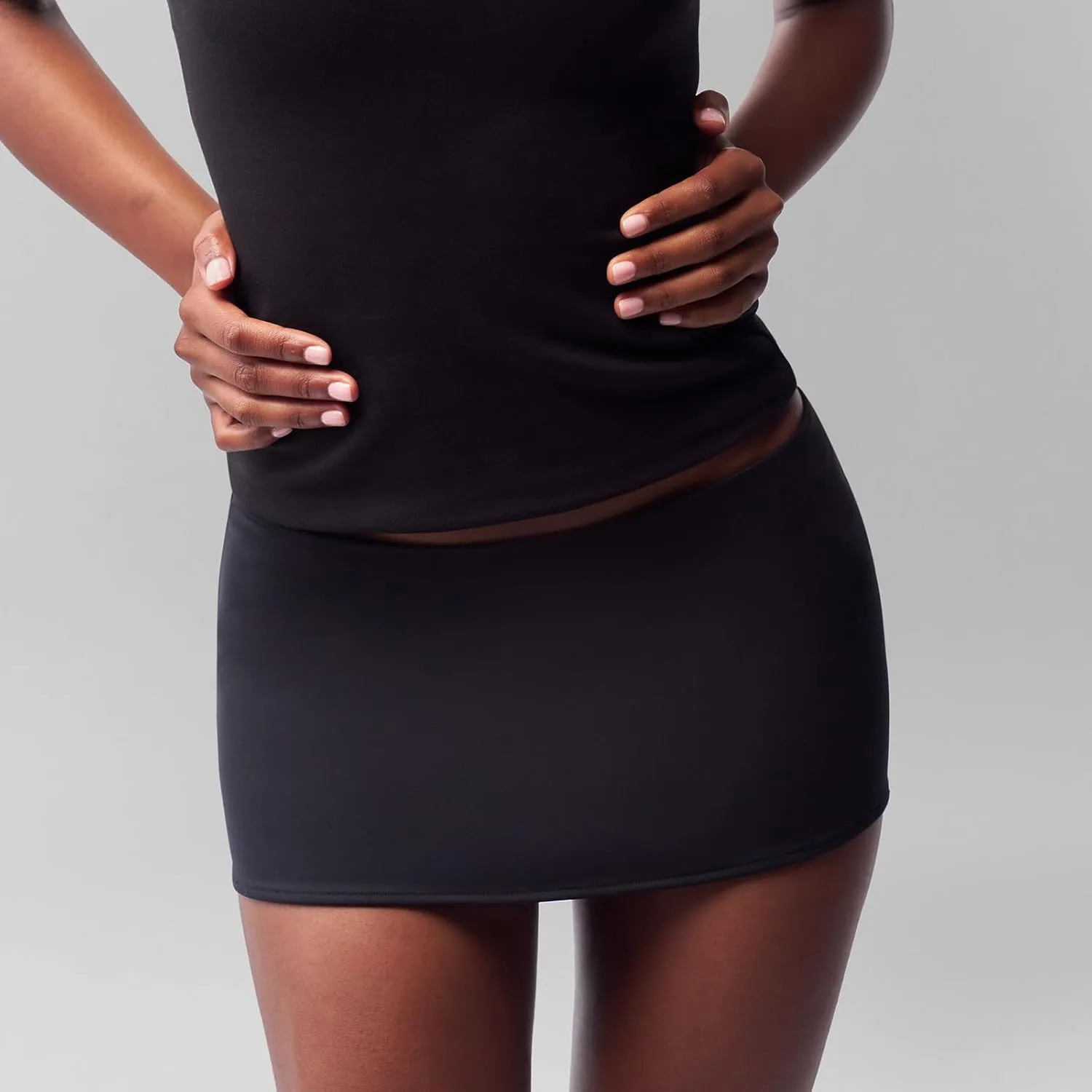 Faretumiya Solid Bodycon Mini Skirt for Women Low Waist Stretch Pencil Short Skirts Slim Fit Office Skirt Streetwear